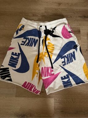 Nike White Shorts with Blue, Pink & Yellow Logo Print